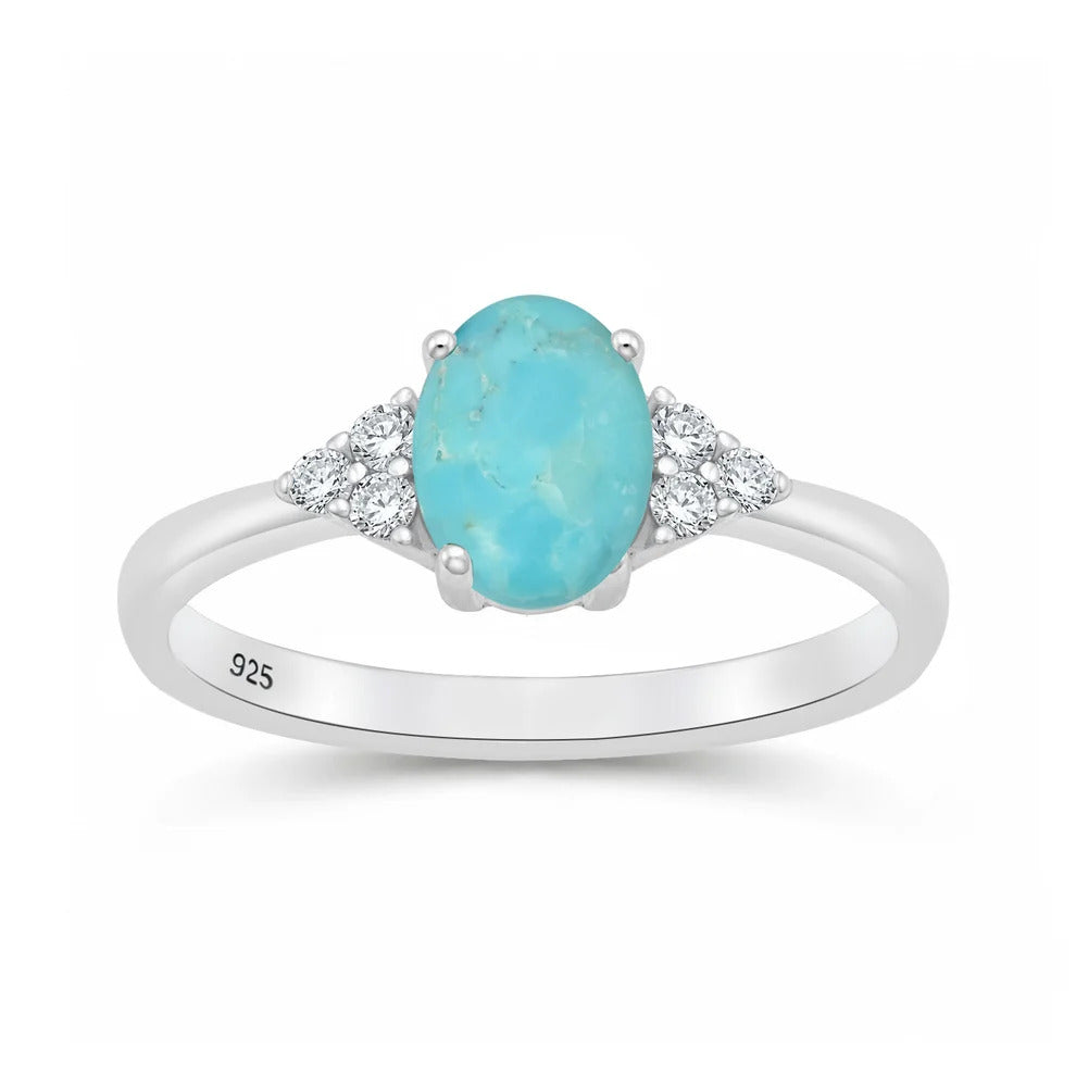 Sterling Silver Rhodium Plated 7mm Oval Turquoise And Clear CZ Ring