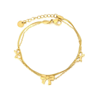 Tresoli Stainless Steel Gold Color PVD Two Hollow Bows And Plain Bow Push Close Chain Bracelet With Round Tag