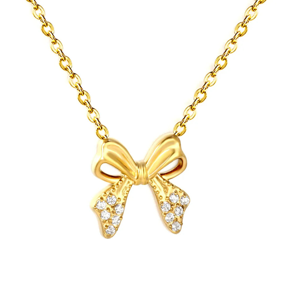 Tresoli Stainless Steel Gold Color PVD Flat Cross Chain Bowknot Inlaid CNC White Zircon Necklace