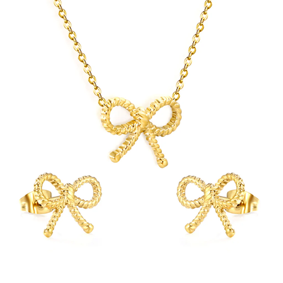 Tresoli Stainless Steel Gold Color PVD Bow With Cross Chain Earrings And Necklace Set