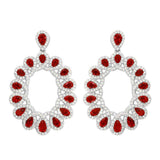 Sterling Silver Rhodium Plated Open Oval Shaped Hanging Earrings With Red And Clear CZ