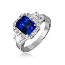 Load image into Gallery viewer, Sterling Silver Rhodium Plated Emerald Cut Center Ring With Blue Sapphire And CZ Stones