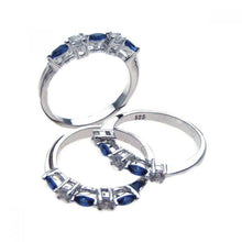 Load image into Gallery viewer, Sterling Silver Rhodium Plated Blue And Clear CZ Round Shaped Eternity RingAnd Dimensions 8mmx22mmAnd Width 3mmAnd Thickness 2mmx4mm