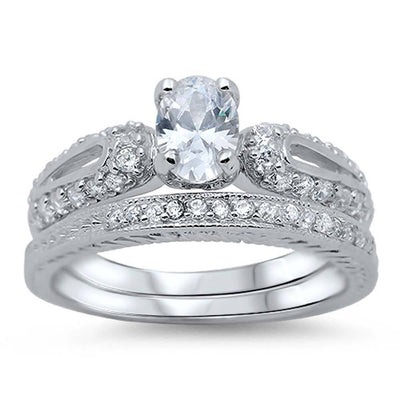 Sterling Silver Pave Set Clear CZ Fancy 2 Piece Engagement Ring Set with a 4 Prong Set Oval Cut Clear CZ in the CenterAnd Ring Face Height of 9MM and Ring Band Width of 3MM