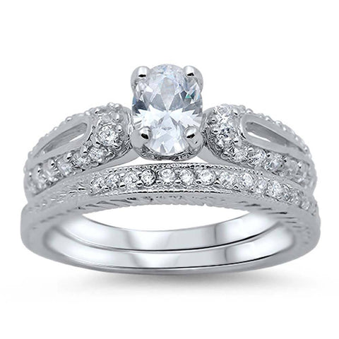 Sterling Silver Pave Set Clear CZ Fancy 2 Piece Engagement Ring Set with a 4 Prong Set Oval Cut Clear CZ in the CenterAnd Ring Face Height of 9MM and Ring Band Width of 3MM
