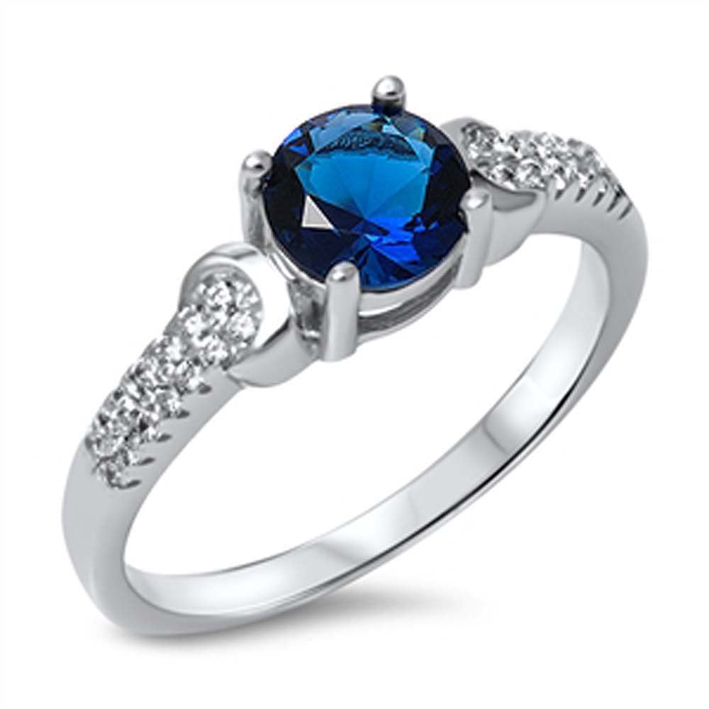Sterling Silver Fancy Buckle Design Embedded with Clear Czs and Centered Round Cut Blue Sapphire Cz RingAnd Center Stone Size of 6MM
